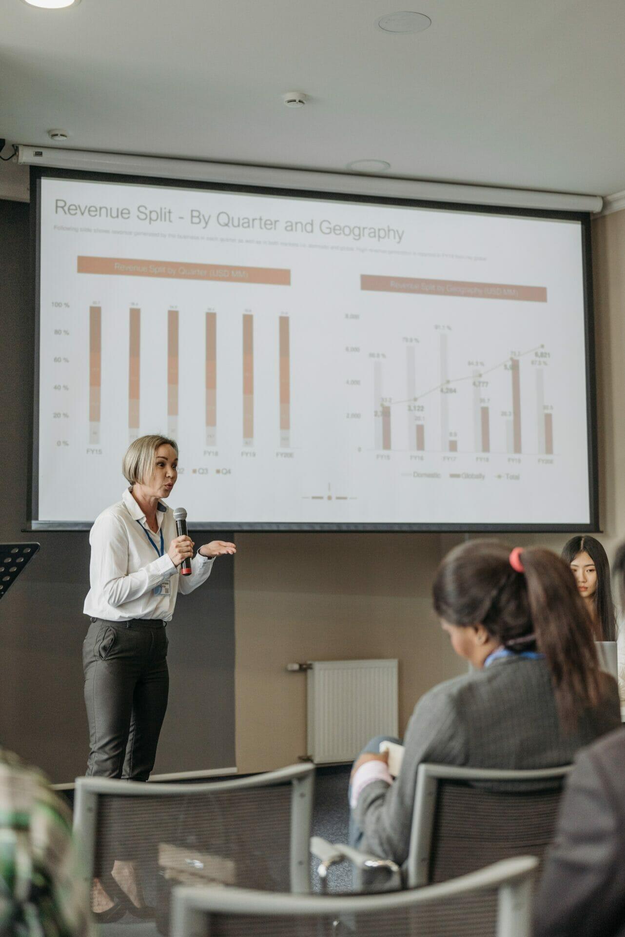 Businesswoman showing graphs during a meeting